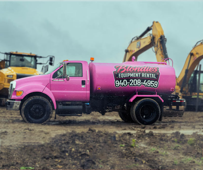 Blondies-Rental-Equipment-Water-Truck-among-construction-equipment-on-work-site-Justin-Texas Blondies Equipment Rental Water Truck on Construction Site in Justin Texas